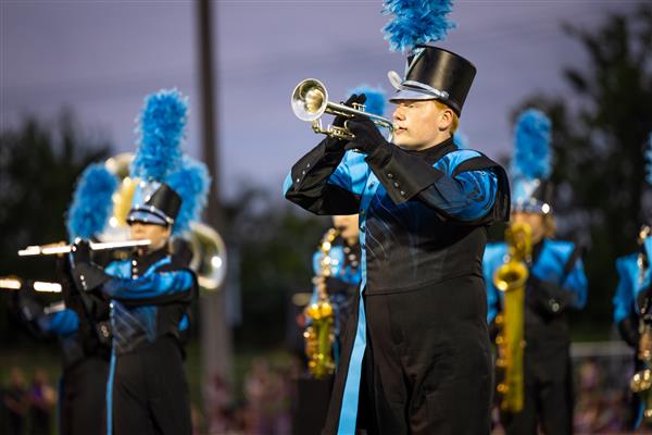 The Centennial High marching band performs